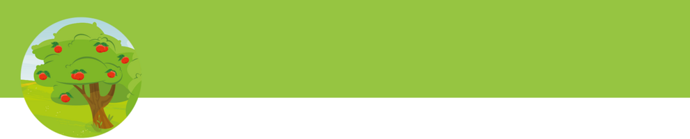 A tree with red fruits stands in a green field.