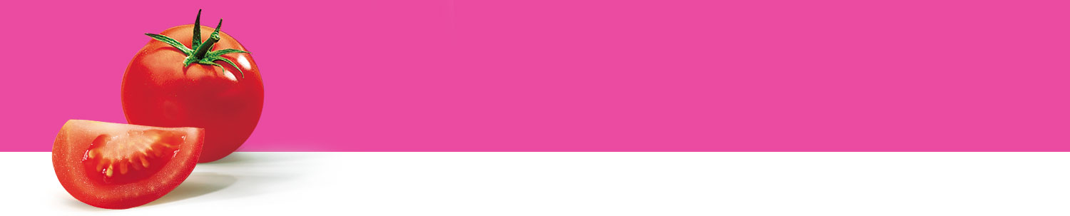 A tomato and a slice of tomato are presented against a pink background.