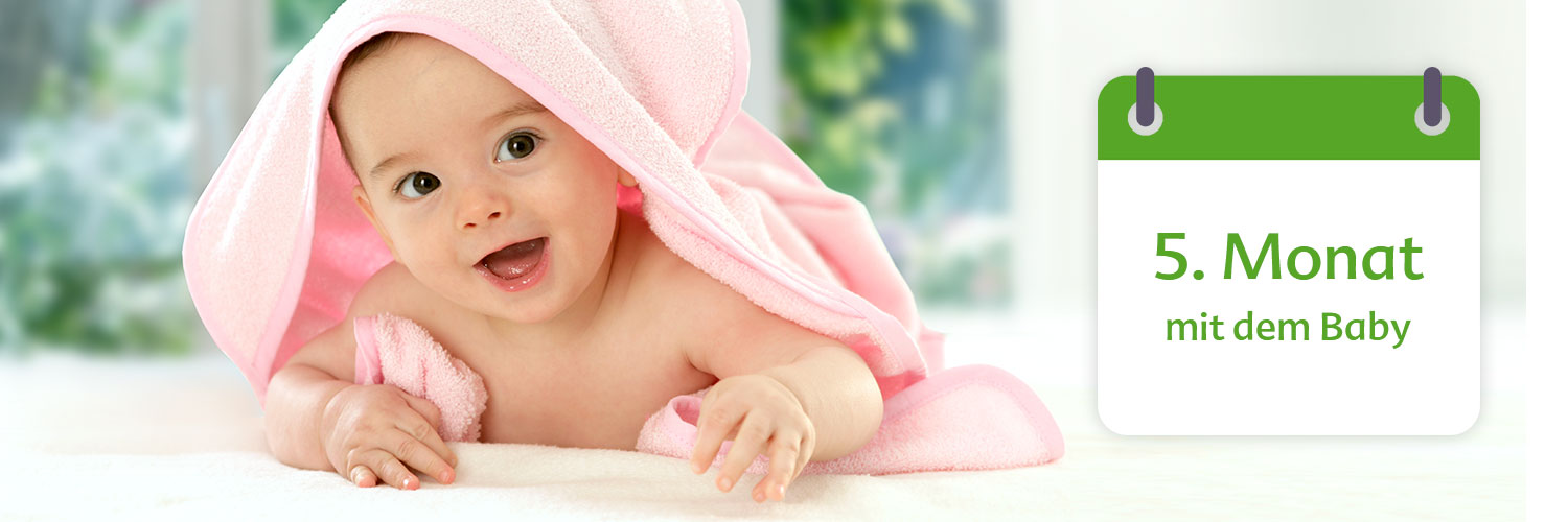 A baby wrapped in a pink towel is shown next to a calendar indicating the fifth month.