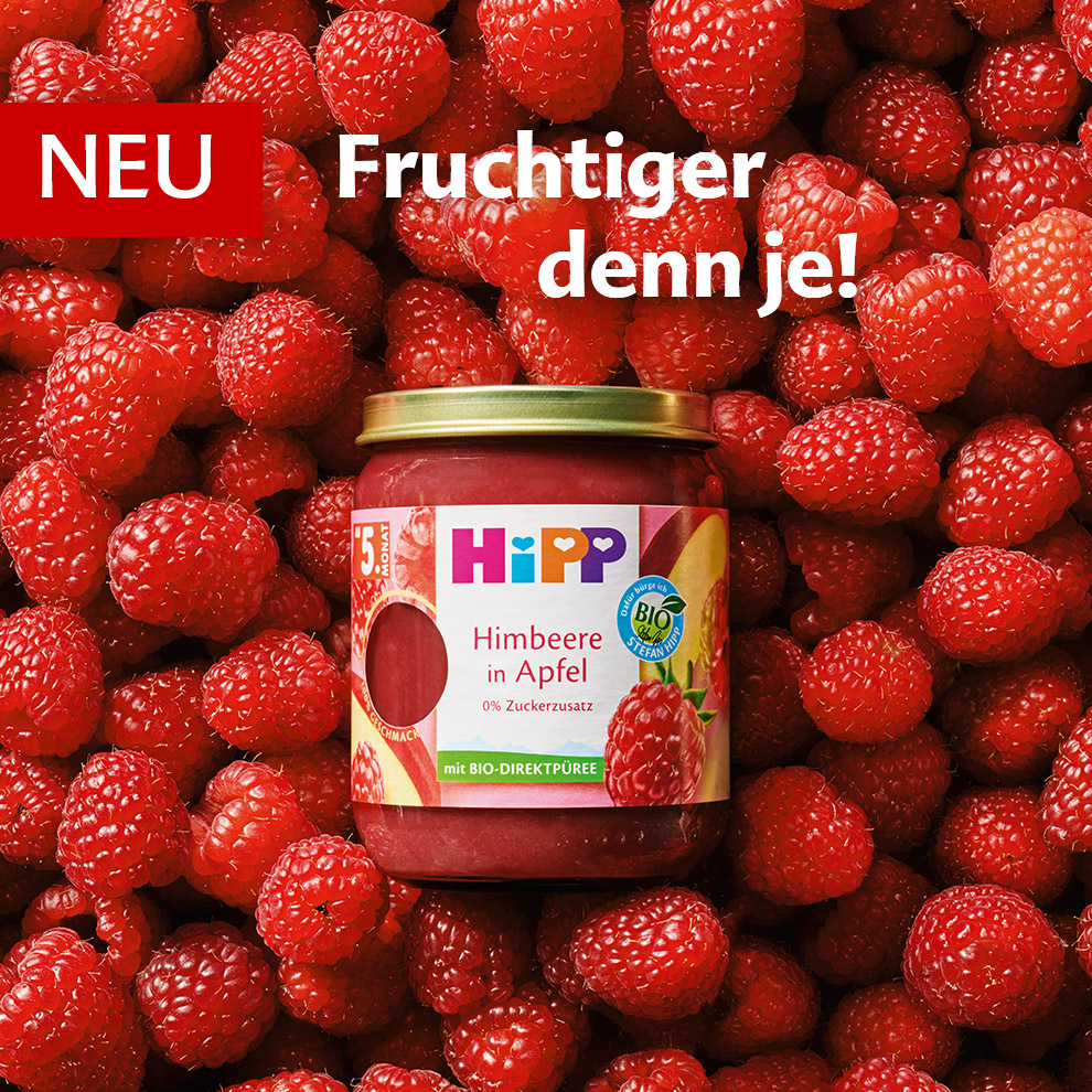 A jar of raspberry jam is placed on a bed of raspberries with the text "NEU Fruchtiger denn je!" and "HIPP Himbeere in Apfel" displayed.
