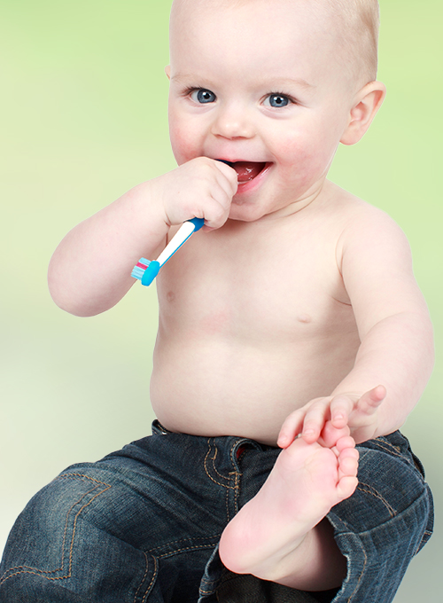 Baby with toothbrush.